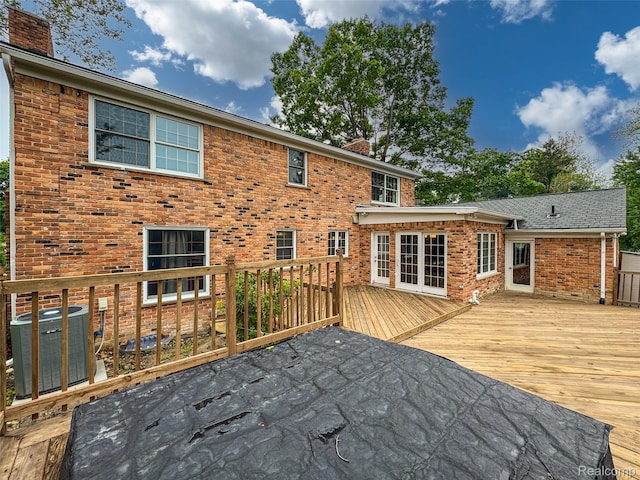 100 Overhill Rd, Bloomfield Hills, MI 48301 - rear view of property with a chimney, central AC unit, a deck, and brick siding