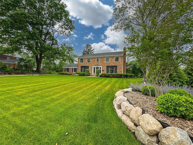 100 Overhill Rd, Bloomfield Hills, MI 48301 - view of front of home with a front lawn, brick siding, and a chimney