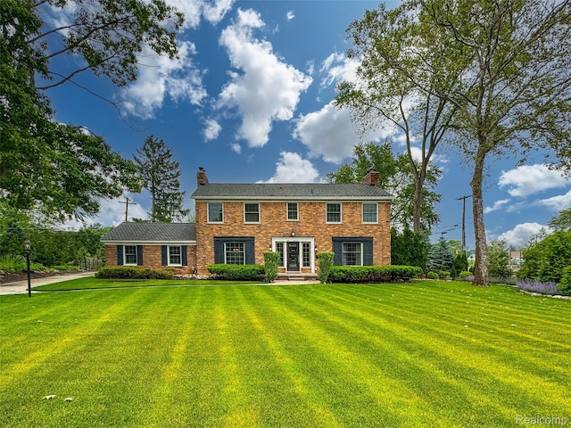 100 Overhill Rd, Bloomfield Hills, MI 48301 - view of front facade with a chimney and a front yard