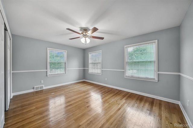 100 Overhill Rd, Bloomfield Hills, MI 48301 - unfurnished room with plenty of natural light, ceiling fan, wood finished floors, and baseboards