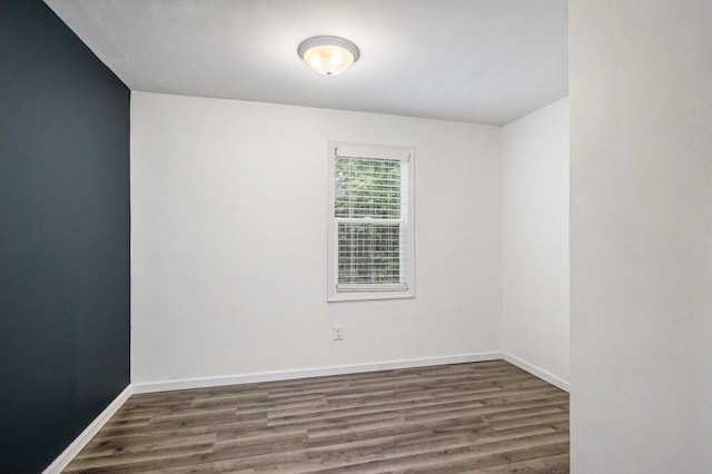 854 Upton Ave, Battle Creek, MI 49037 - empty room with wood finished floors and baseboards