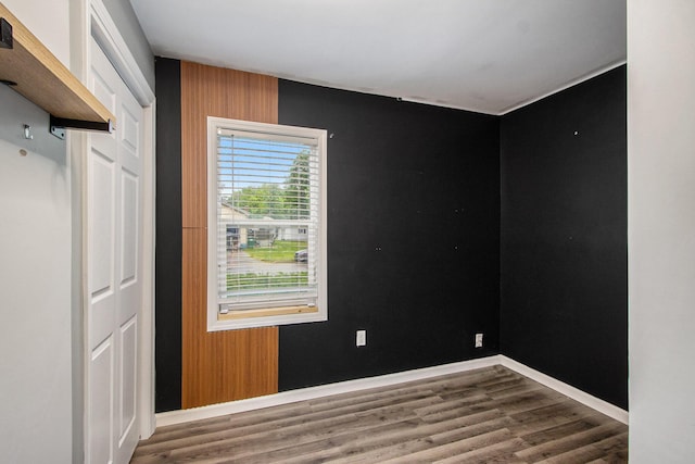 854 Upton Ave, Battle Creek, MI 49037 - empty room with wood finished floors and baseboards