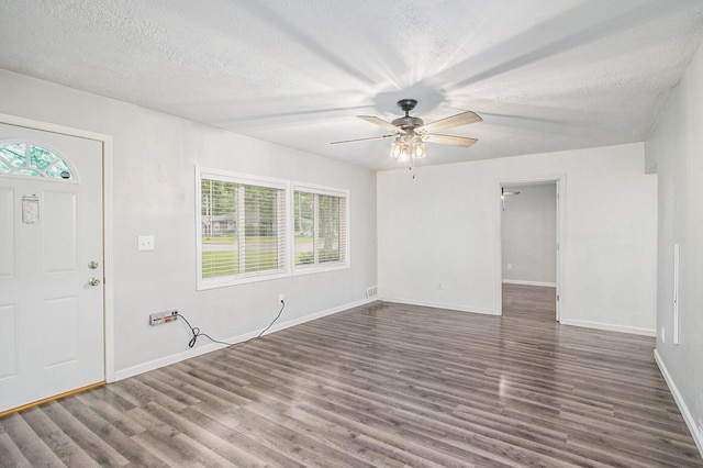 854 Upton Ave, Battle Creek, MI 49037 - foyer entrance featuring wood finished floors, a textured ceiling, ceiling fan, and baseboards