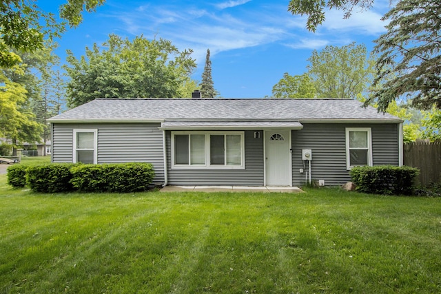854 Upton Ave, Battle Creek, MI 49037 - view of front facade featuring roof with shingles