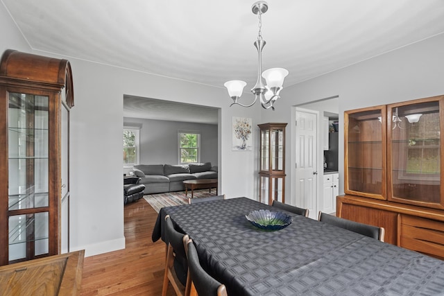 2961 E B Ave, Plainwell, MI 49080 - dining space with wood finished floors and a chandelier