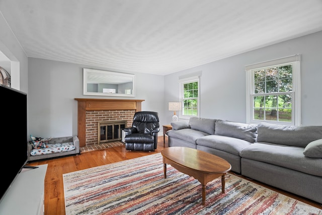 2961 E B Ave, Plainwell, MI 49080 - living room with wood finished floors and a brick fireplace