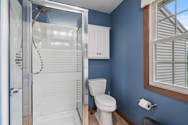2961 E B Ave, Plainwell, MI 49080 - bathroom featuring toilet, a stall shower, baseboards, and a textured ceiling
