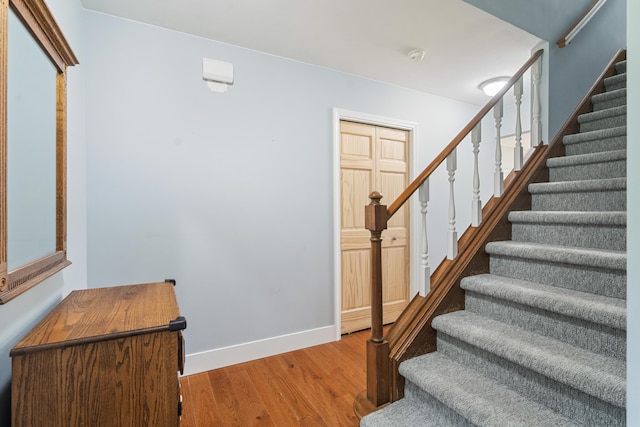 2961 E B Ave, Plainwell, MI 49080 - staircase featuring wood finished floors and baseboards