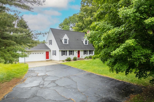 2961 E B Ave, Plainwell, MI 49080 - new england style home with asphalt driveway, an attached garage, a front lawn, and a chimney