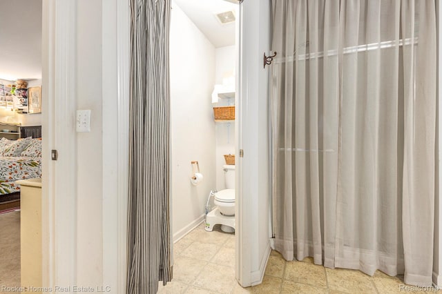 1653 Crab Apple Dr, Ypsilanti, MI 48198 - ensuite bathroom featuring toilet and baseboards