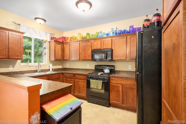 1653 Crab Apple Dr, Ypsilanti, MI 48198 - kitchen with black appliances, dark countertops, brown cabinets, and a peninsula
