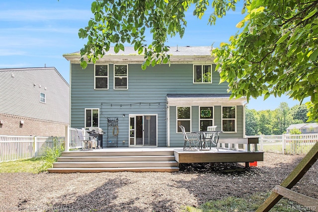1653 Crab Apple Dr, Ypsilanti, MI 48198 - back of house with a fenced backyard, a deck, and outdoor dining area