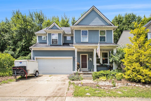 1653 Crab Apple Dr, Ypsilanti, MI 48198 - view of front of property with a porch, an attached garage, and concrete driveway