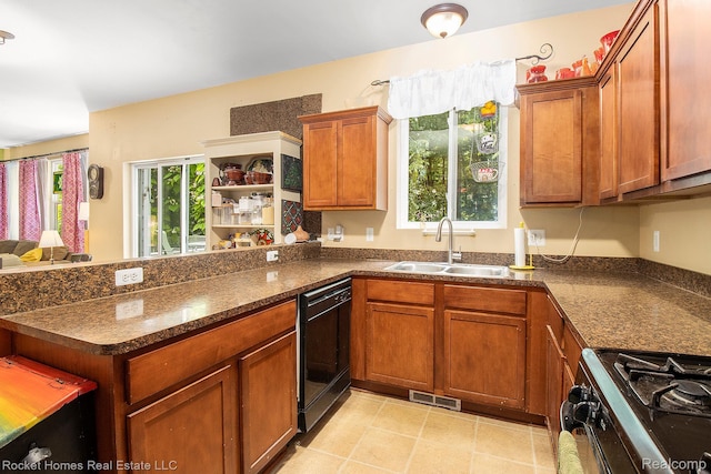 1653 Crab Apple Dr, Ypsilanti, MI 48198 - kitchen with black dishwasher, range with gas stovetop, a peninsula, brown cabinetry, and open shelves