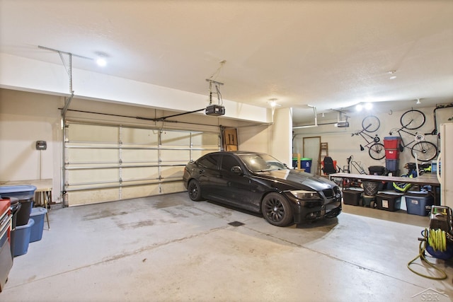 3156 Sundown Ln, Saginaw, MI 48603 - garage featuring a garage door opener