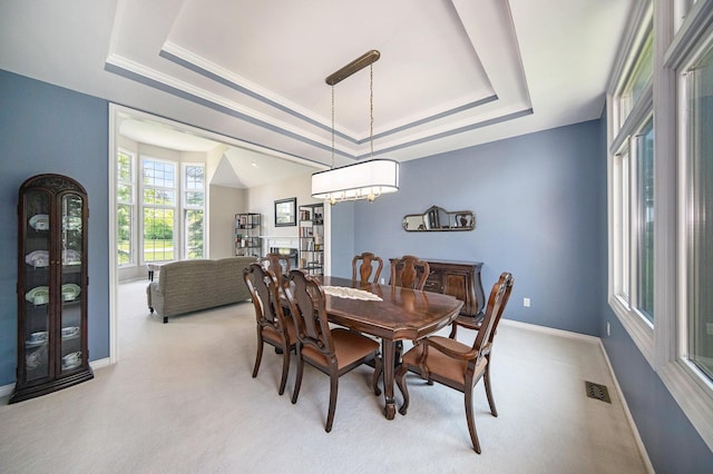 4251 Fleming Way, Plymouth, MI 48170 - dining area featuring a raised ceiling, light colored carpet, baseboards, and a chandelier