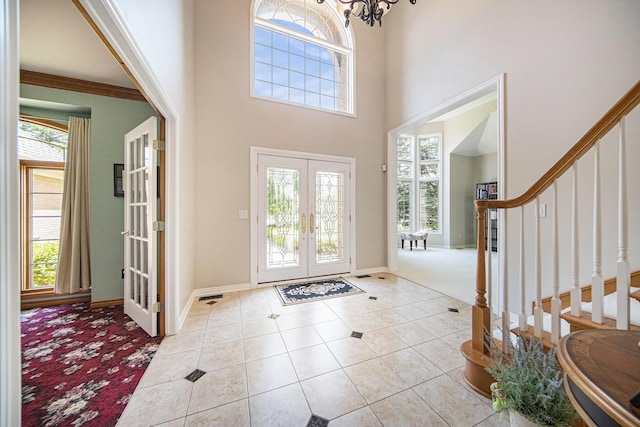 4251 Fleming Way, Plymouth, MI 48170 - entrance foyer featuring french doors, stairway, light carpet, baseboards, and light tile patterned floors