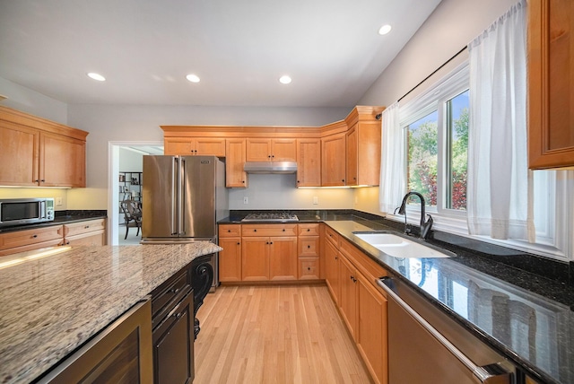 4251 Fleming Way, Plymouth, MI 48170 - kitchen with a sink, under cabinet range hood, appliances with stainless steel finishes, light wood-style flooring, and dark stone counters