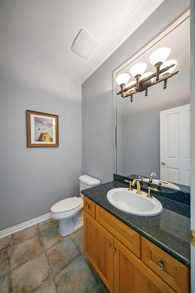 4251 Fleming Way, Plymouth, MI 48170 - bathroom with vanity, toilet, baseboards, and a chandelier