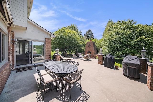 4251 Fleming Way, Plymouth, MI 48170 - view of patio / terrace with a lit fireplace, outdoor dining area, and area for grilling