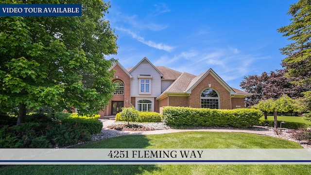 4251 Fleming Way, Plymouth, MI 48170 - traditional home with brick siding and a front yard
