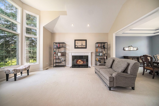 4251 Fleming Way, Plymouth, MI 48170 - living area featuring light carpet, plenty of natural light, a tiled fireplace, and vaulted ceiling