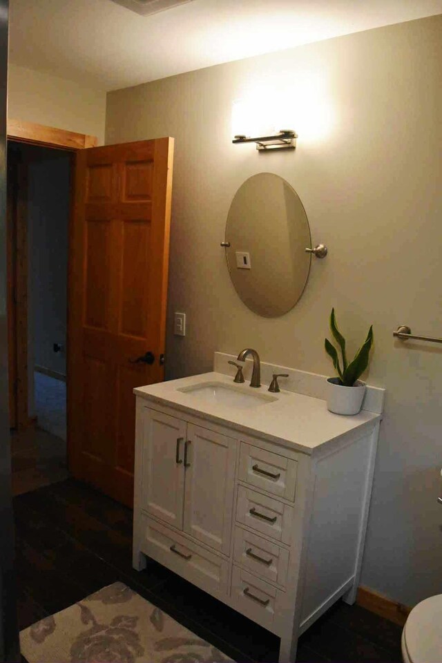 2735 Nestrom Rd, Muskegon, MI 49445 - bathroom featuring vanity and toilet