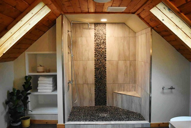 2735 Nestrom Rd, Muskegon, MI 49445 - full bath featuring vaulted ceiling, wooden ceiling, a tile shower, and toilet