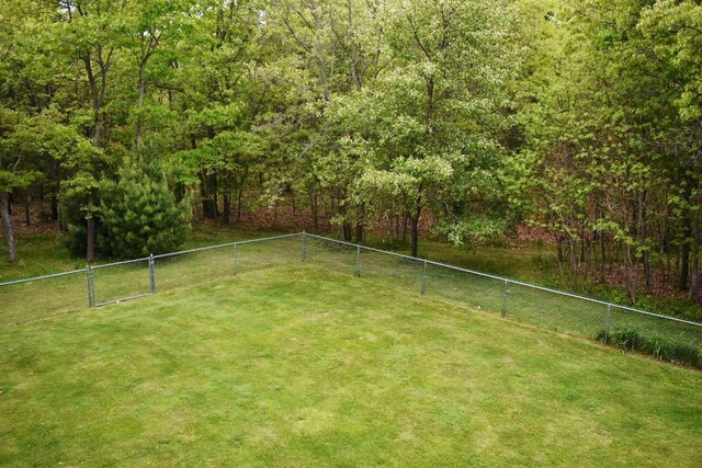 2735 Nestrom Rd, Muskegon, MI 49445 - view of yard with a forest view