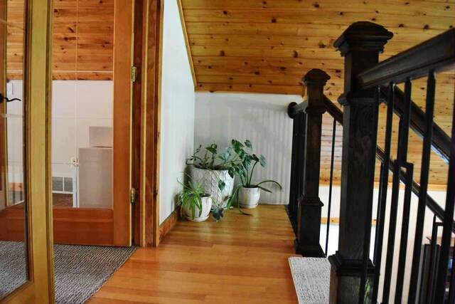 2735 Nestrom Rd, Muskegon, MI 49445 - hall with wood finished floors, stairs, and wooden walls
