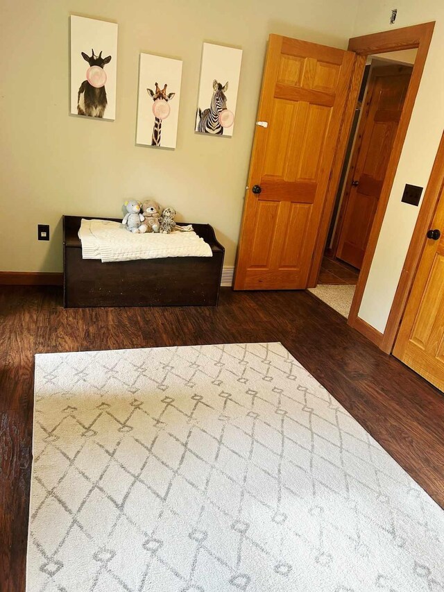 2735 Nestrom Rd, Muskegon, MI 49445 - bedroom featuring dark wood-style flooring and baseboards