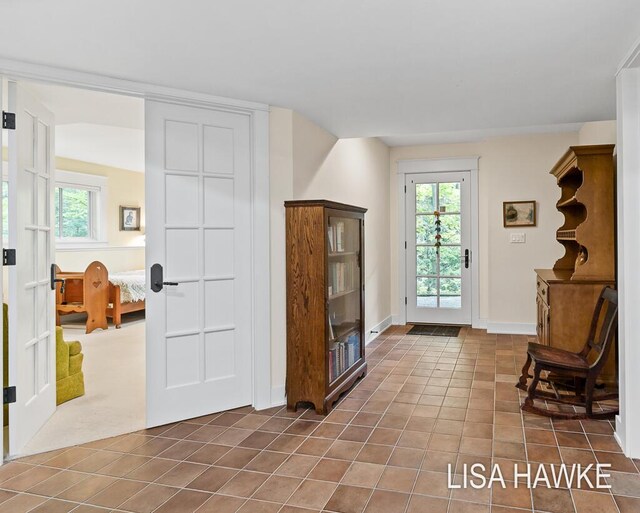12857 Wilderness Trl, Grand Haven, MI 49417 - foyer with dark tile patterned floors