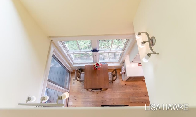 12857 Wilderness Trl, Grand Haven, MI 49417 - living room with a skylight and wood finished floors