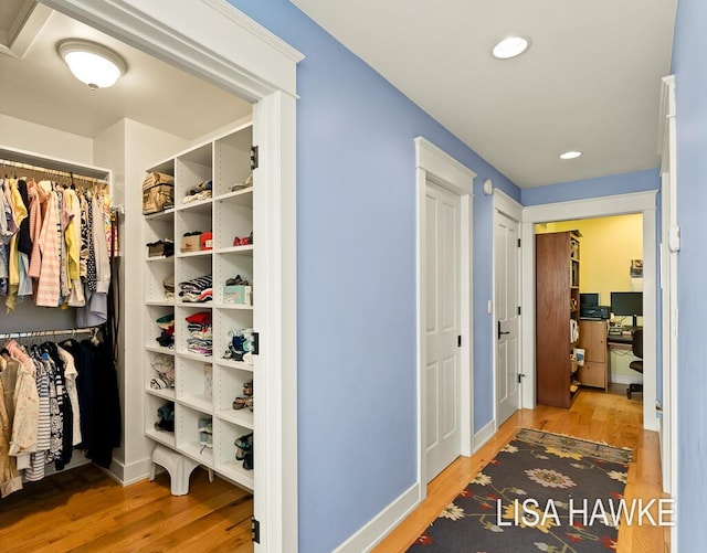 12857 Wilderness Trl, Grand Haven, MI 49417 - spacious closet featuring wood finished floors
