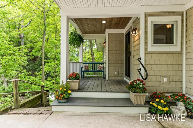 12857 Wilderness Trl, Grand Haven, MI 49417 - view of exterior entry featuring covered porch