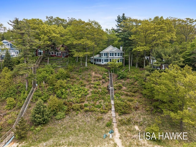 12857 Wilderness Trl, Grand Haven, MI 49417 - view of yard with stairs and a wooded view