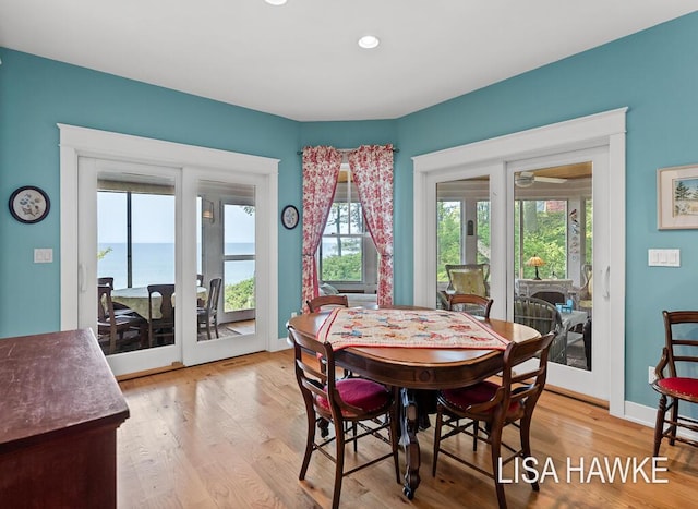 12857 Wilderness Trl, Grand Haven, MI 49417 - dining area featuring healthy amount of natural light, light wood-style flooring, ceiling fan, and recessed lighting