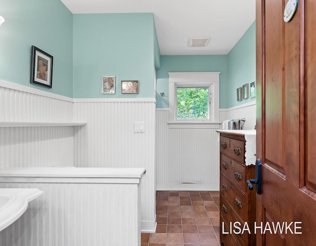 12857 Wilderness Trl, Grand Haven, MI 49417 - bathroom with a wainscoted wall