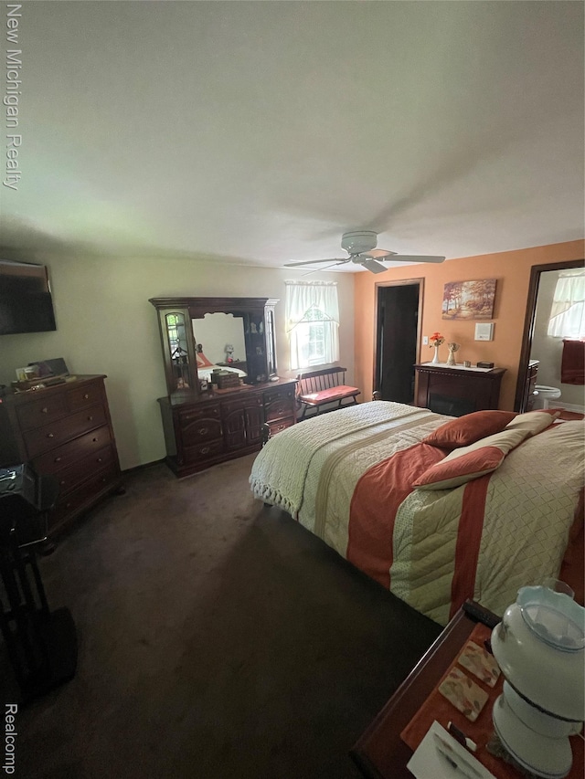 6567 Heaven Dr, Howell, MI 48855 - carpeted bedroom with a ceiling fan