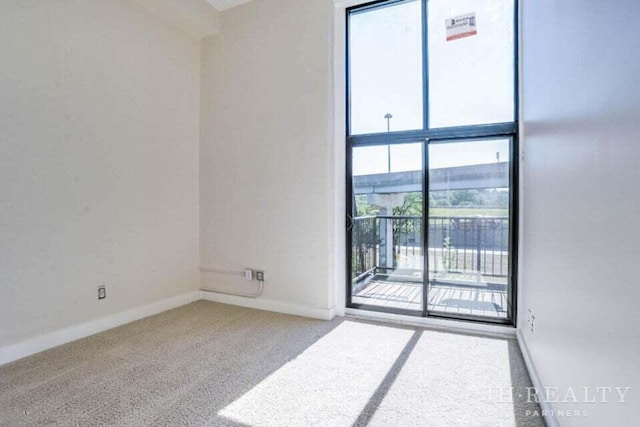 600 NW Broadway Ave Unit 318, Grand Rapids, MI 49504 - carpeted spare room with baseboards