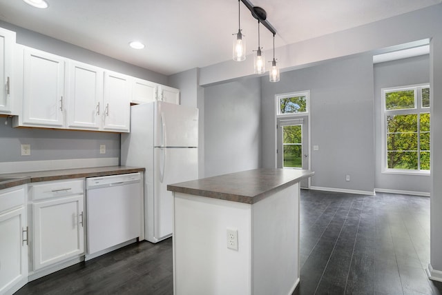 302 NE Xing, Holland, MI 49423 - kitchen with white appliances, dark countertops, healthy amount of natural light, dark wood-type flooring, and recessed lighting