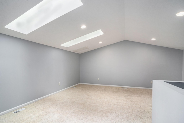 302 NE Xing, Holland, MI 49423 - bonus room featuring a skylight, carpet, recessed lighting, vaulted ceiling, and baseboards