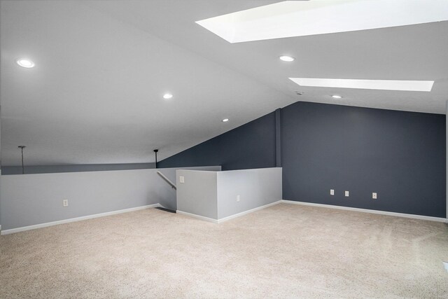 302 NE Xing, Holland, MI 49423 - bonus room with a skylight, vaulted ceiling, carpet flooring, recessed lighting, and baseboards
