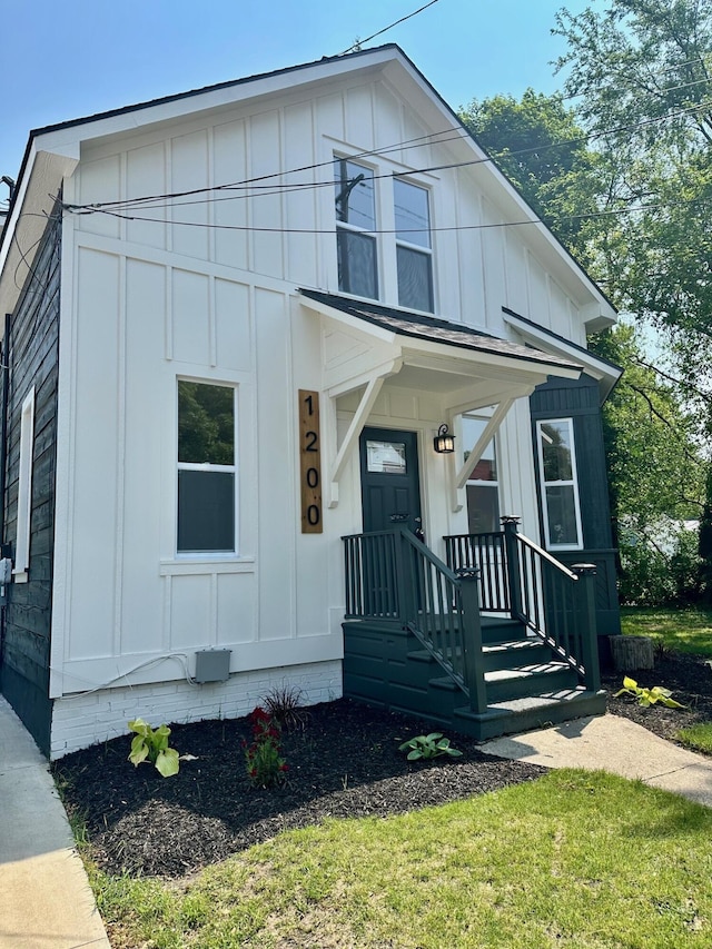 1200 Pine St, Muskegon, MI 49442 - view of front of home with board and batten siding