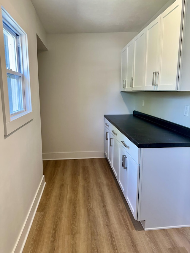 1200 Pine St, Muskegon, MI 49442 - bar featuring wood finished floors and baseboards