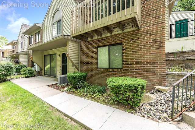 410 Spring Brooke Dr, Brighton, MI 48116 - view of side of home with brick siding and a balcony