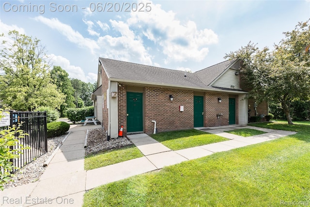 410 Spring Brooke Dr, Brighton, MI 48116 - view of front of home featuring brick siding and roof with shingles
