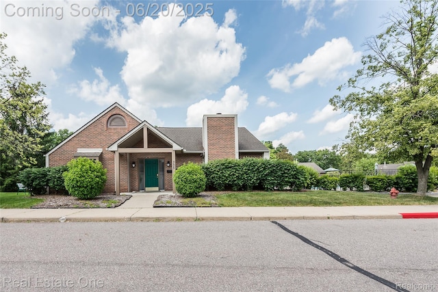 410 Spring Brooke Dr, Brighton, MI 48116 - view of front of property with brick siding and a chimney