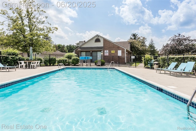 410 Spring Brooke Dr, Brighton, MI 48116 - community pool with a patio area