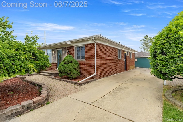 8786 N Evangeline St, Dearborn Heights, MI 48127 - view of property exterior with brick siding and driveway